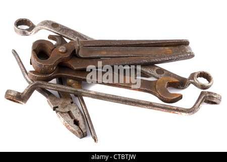 pile of old rusted wrenches and other tools on white background Stock Photo