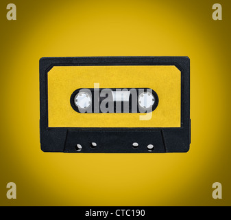 Retro cassette on yellow background Stock Photo