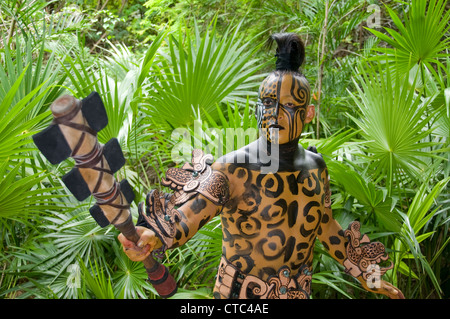 A Maya sacred animal actor/dancer in Dios Jaguar dress (costume) at the Riviera Maya's Xcaret Park in Mexico. Stock Photo