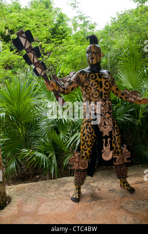 A Maya sacred animal actor/dancer in Dios Jaguar dress (costume) at the Riviera Maya's Xcaret Park in Mexico. Stock Photo