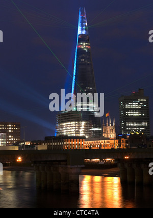 The Shard, London Bridge Europe's tallest building at 308 meters celebrated its completion with a laser light show Stock Photo