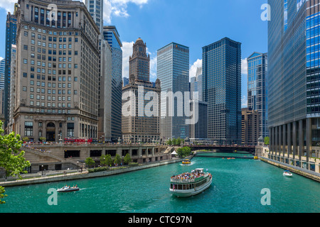 Downtown skyline and tour boat on the Chicago River from near the Michigan Avenue Bridge, Chicago, Illinois, USA Stock Photo