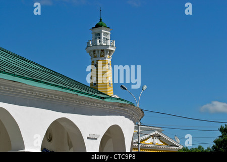 Big flour arcades (central market) with fire tower (1823-1826) in the centre of the city of Kostroma, Russia Stock Photo