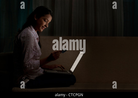 Young woman doing online shopping Stock Photo
