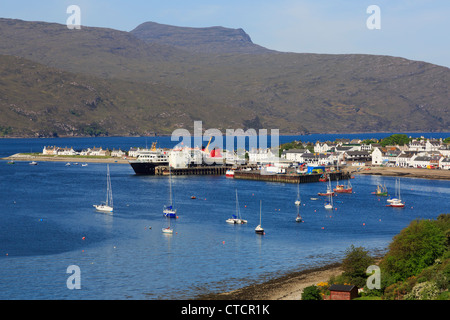 View to fishing port on Loch Broom with ferry in dock on North Coast 500 route at Ullapool Wester Ross Ross and Cromarty Scotland UK Stock Photo