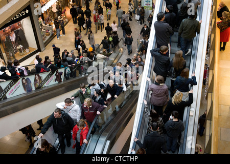 Busy escalators inside the Bullring shopping centre, Birmingham. Picture taken two weeks before Christmas. Stock Photo