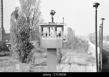 The Berlin Wall  and watch tower at Staaken during the cold War in 1983 Stock Photo