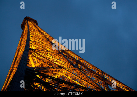 A late night view up from the second floor Eiffel Tower in Paris, France. Stock Photo