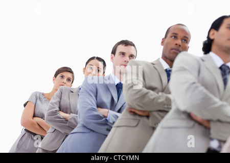 Low-angle shot of colleagues crossing their arms in a single line Stock Photo