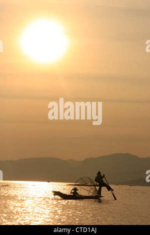 Inle lake fisherman at sunset, Shan state, Myanmar, Southeast Asia Stock Photo