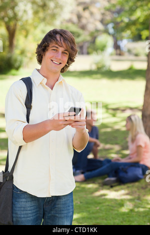 Portrait of a young man using a smartphone Stock Photo