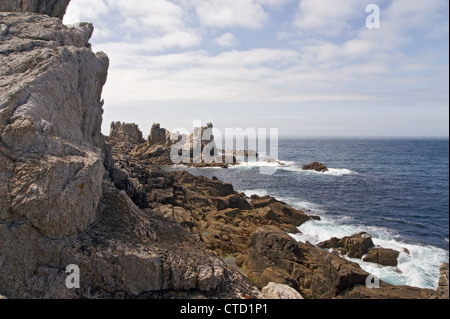 Cliff by the coast over the sea in sunset at summer Stock Photo
