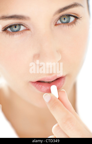 Woman taking medication Stock Photo