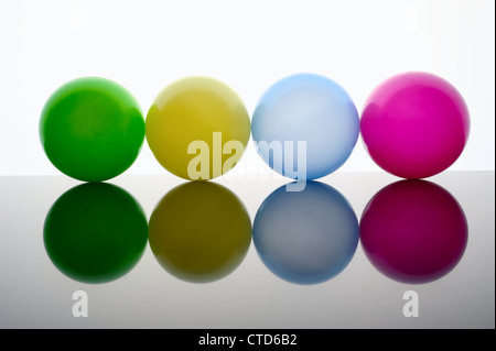 Colored balls on the dark surface Stock Photo