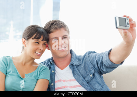 A smiling couple pose together for a photo Stock Photo