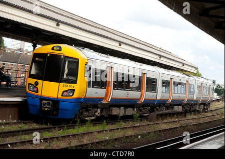 Class 378 passenger train in London Overground livery at Clapham Junction, England. Stock Photo