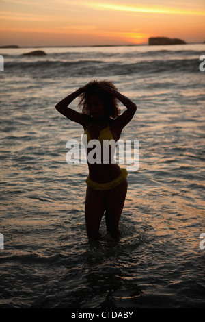 Young attractive woman standing in the water Stock Photo