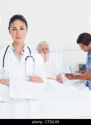 Doctor with a serious expression crossing her arms Stock Photo