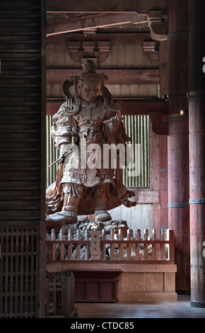 A huge statue of Komoku-ten, the Guardian King of the West, in the Great Buddha Hall (Daibutsuden) of the Buddhist temple of Todai-ji, Nara, Japan Stock Photo