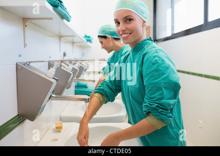 Nurse washing hands Stock Photo