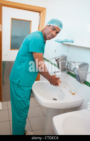 Male surgeon washing his hands Stock Photo