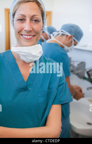 Smiling female surgeon with his arms folded Stock Photo