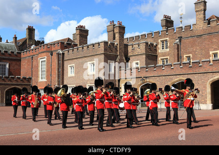 The ceremonial Grenadier Guards marching out of St James's Palace towards Buckingham Palace in London, UK Stock Photo