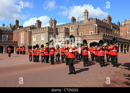 The ceremonial Grenadier Guards marching out of St James's Palace towards Buckingham Palace in London, UK Stock Photo