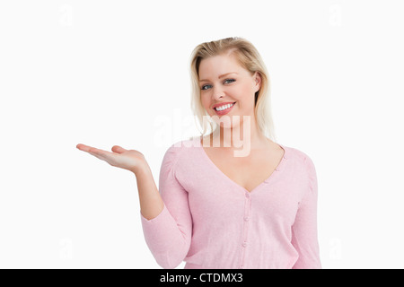 Blonde woman placing her hand palm up Stock Photo