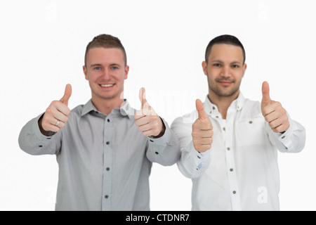 Two men putting their thumbs up Stock Photo