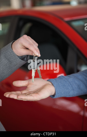Keys given to someone Stock Photo