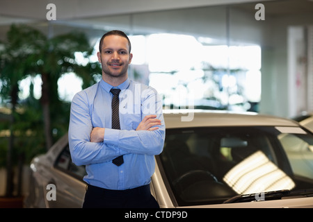 Man standing while crossing his arms Stock Photo