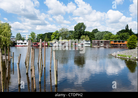 June 2012 Row of luxurious house boats along the Schinkel opposite the Olympic Stadium. Stock Photo