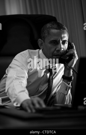 US President Barack Obama talks on the phone with Prime Minister Mario Monti of Italy about the Euro Crisis aboard Air Force One June 6, 2012 enroute to Los Angeles, CA. Stock Photo