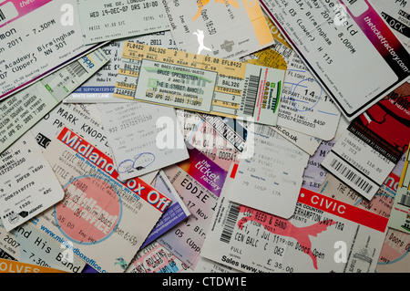A pile of concert and airplane tickets Stock Photo