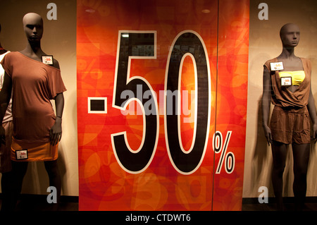 Sales sign in shop window in Florence, Italy Stock Photo