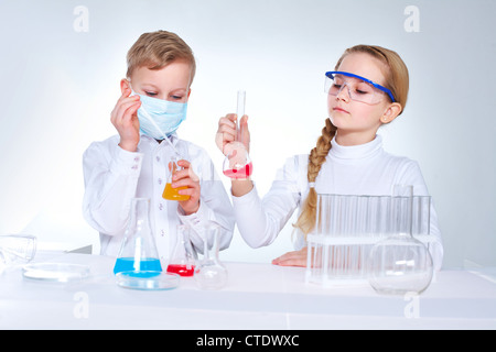 Young scientists mixing chemical substances in the lad Stock Photo