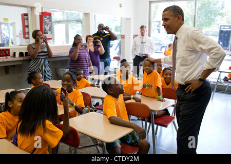 US President Barack Obama talks to a group of kids from Lenora Academy during a campaign stop at the Varsity restaurant June 26, 2012 in Atlanta, GA. Stock Photo