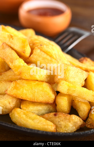 French fries with ketchup (Selective Focus, Focus one third into the fries) Stock Photo