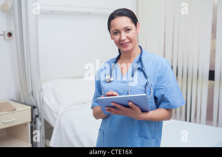 Nurse using a tablet pc Stock Photo