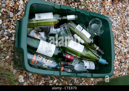Glass bottles & jars in a recycling bin Stock Photo