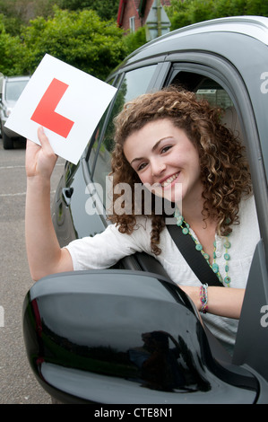 Young female driver holding L learner Stock Photo