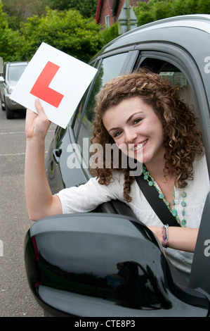 Young female driver holding L learner Stock Photo