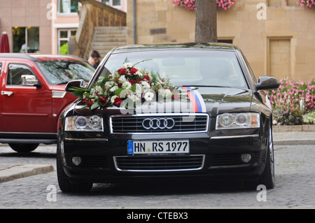 Black Audi A8 Station Wagon Wedding Car Luxury Limousine Vehicle with Marriage Flower Bouquet on Bonnet Hood - Heilbronn Germany Stock Photo