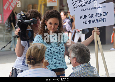 SWR Suedwestrundfunk German Television Crew Cameraman Female Reporter interviews people in public street ENG - Heibronn Germany