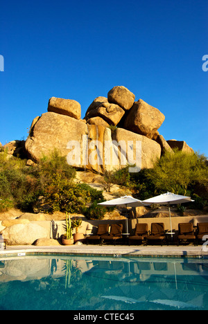 Waterfalls wind eroded granite rock formations form backdrop Boulders ...