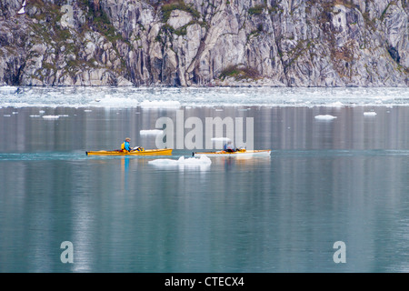 Kayakers and icebergs near Northwestern Glacier in Northwestern Fjord of the Kenai Fjords National Park in Alaska. Stock Photo
