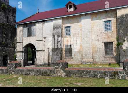 exterior of the Baclayon church on Bohol, Philippines. You can see the face of St. Padre Pio on the wall. Stock Photo