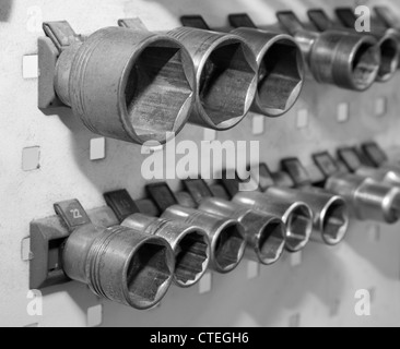 Screw wrench on the wall in work room Stock Photo