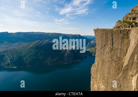 A woman enjoys the view from the Pulpit Rock, Norway Stock Photo